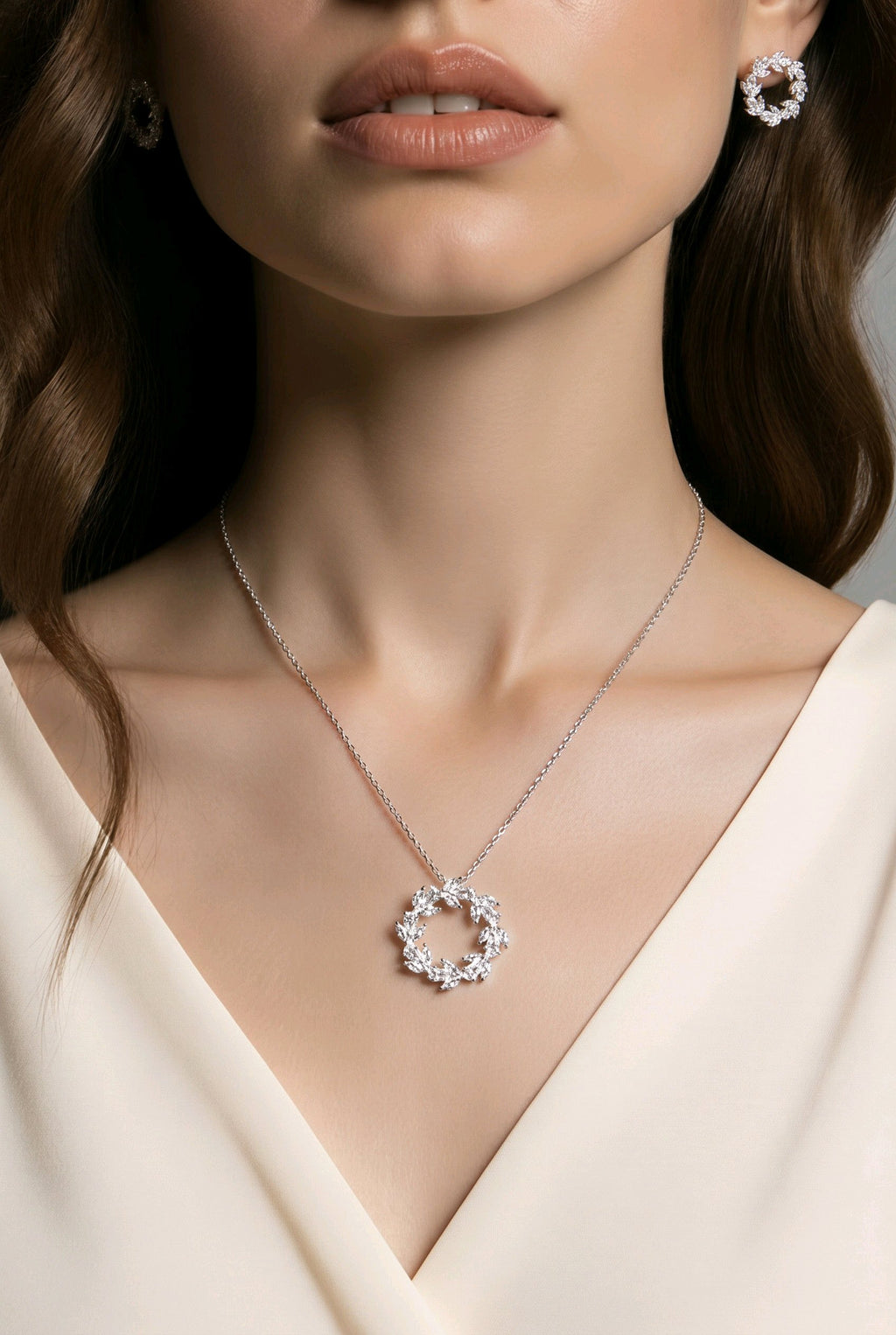 Model wearing the Laurel Wreath CZ necklace and earrings in silver-tone finish