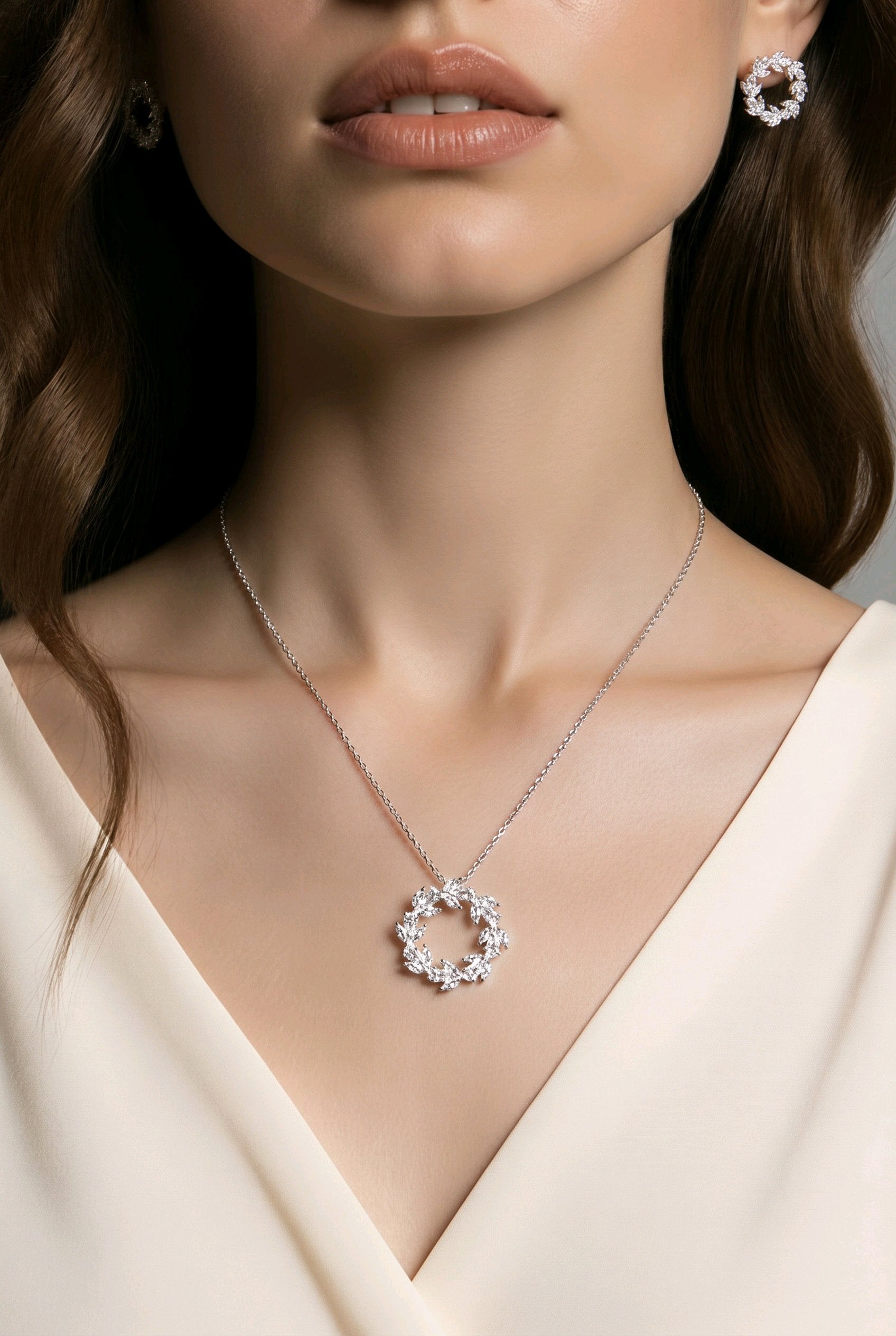 Model wearing the Laurel Wreath CZ necklace and earrings in silver-tone finish