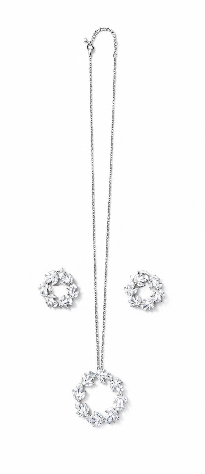 Flat lay of the Laurel Wreath CZ necklace and stud earrings on white background
