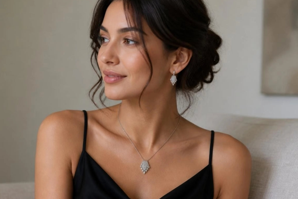 Model wearing Art Deco Fan CZ necklace and earrings with black dress