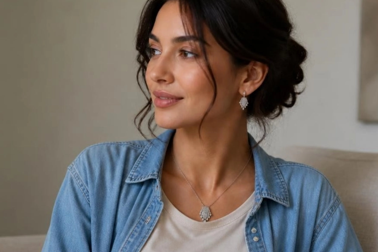 Model wearing Art Deco Fan CZ necklace and earrings with denim shirt