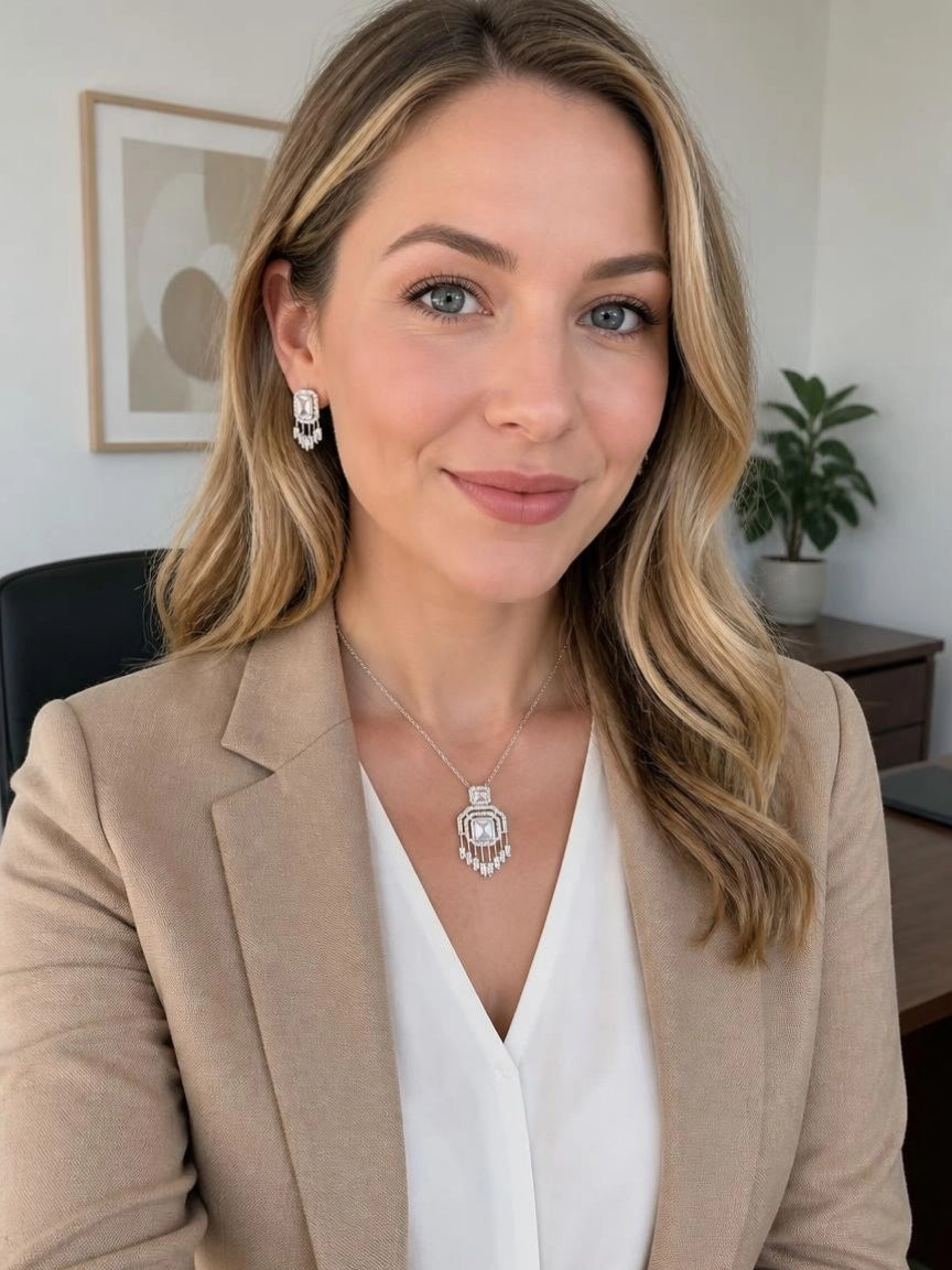Model wearing Gatsby Fringe CZ necklace and earrings with beige blazer and white top