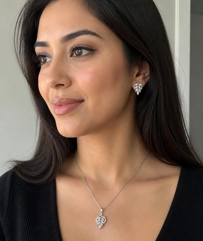 Model wearing Marquise Leaf CZ necklace and earrings with black v-neck top