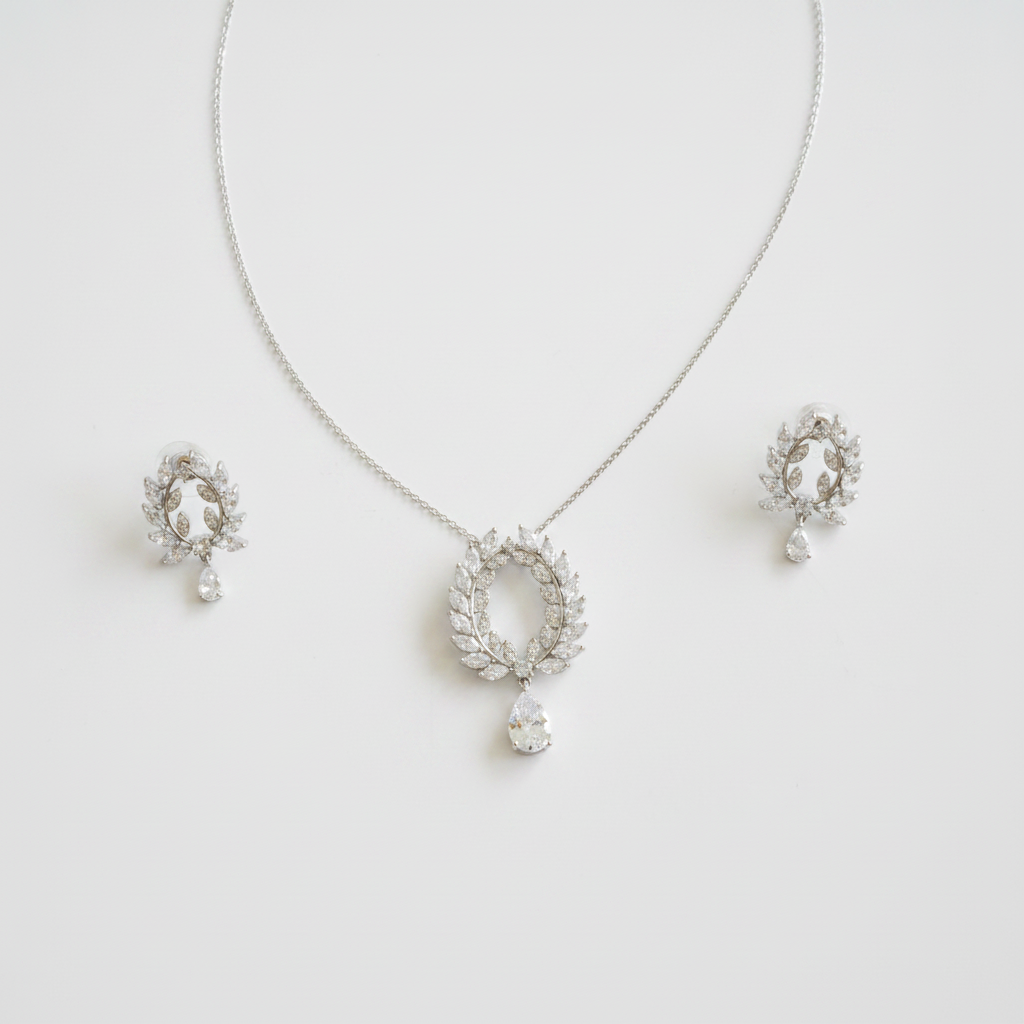 CZ laurel wreath jewelry set spread on white background