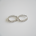 Cubic zirconia lattice hoop earrings front view on white background