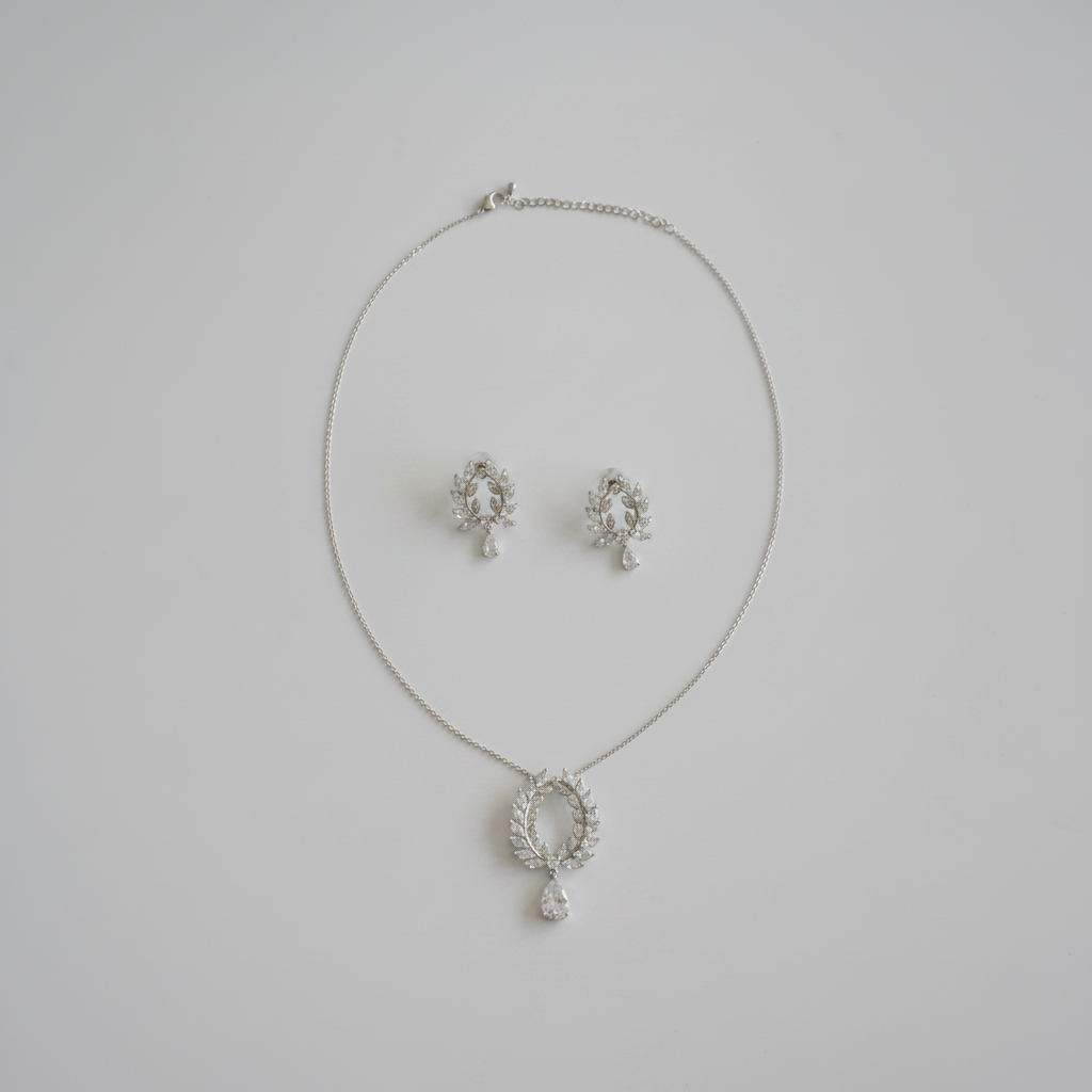 CZ laurel wreath jewelry set flat lay on white background