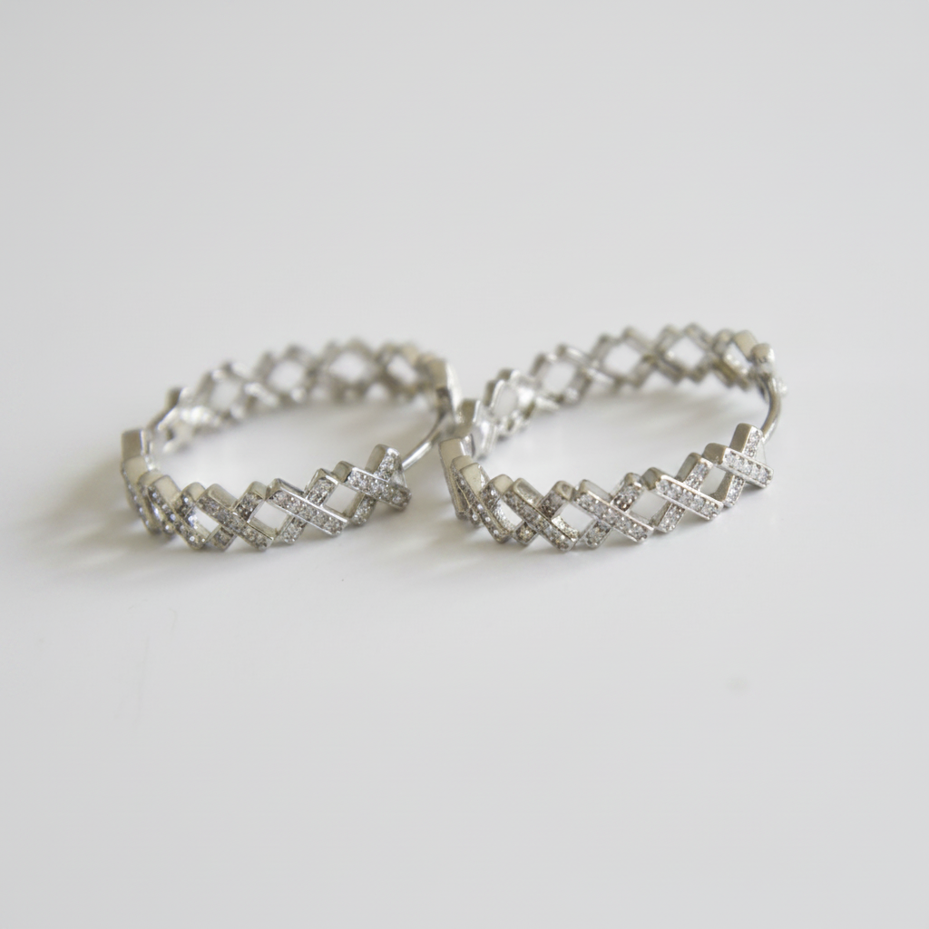 Cubic zirconia lattice hoop earrings angle view on white background