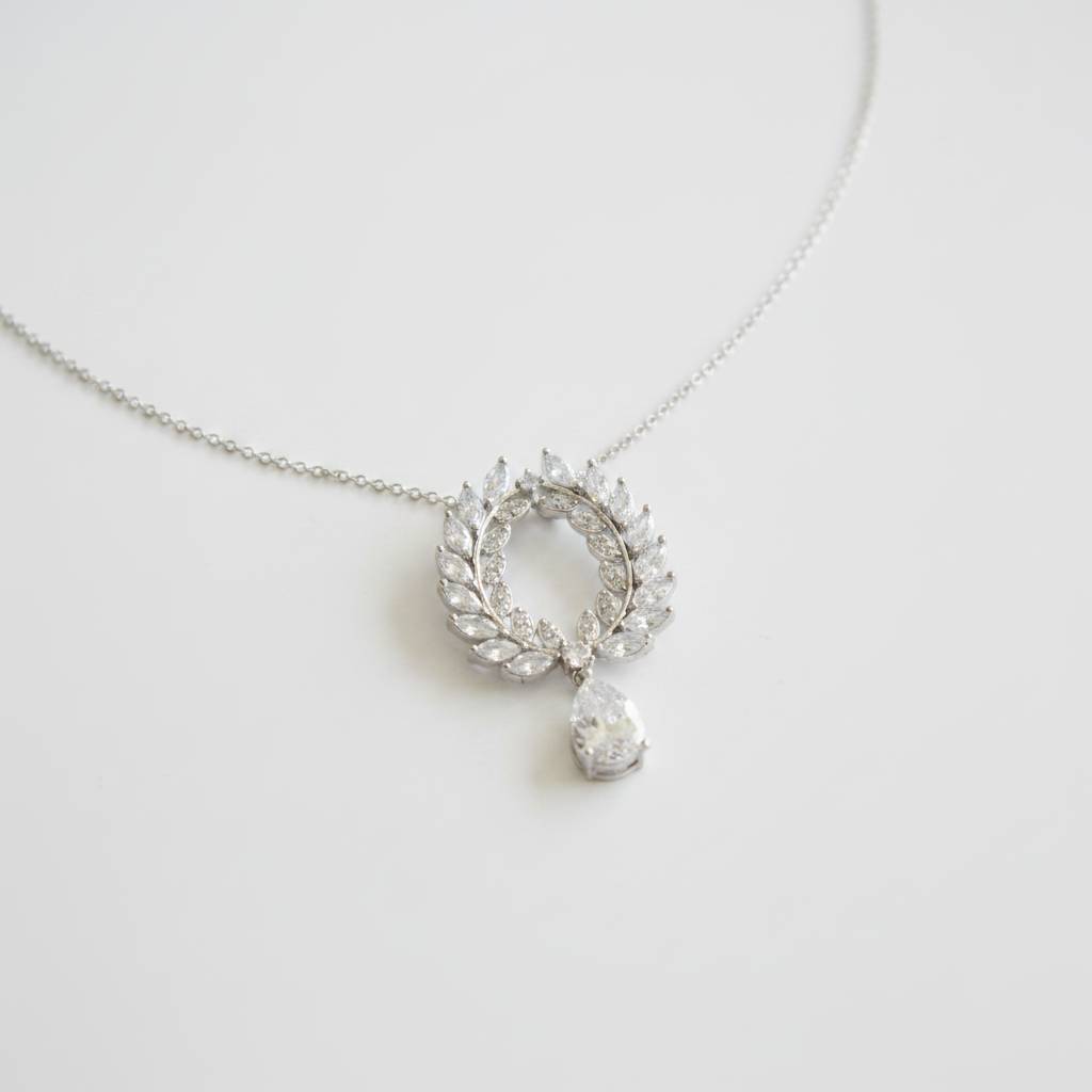 CZ laurel wreath pendant close-up on white background